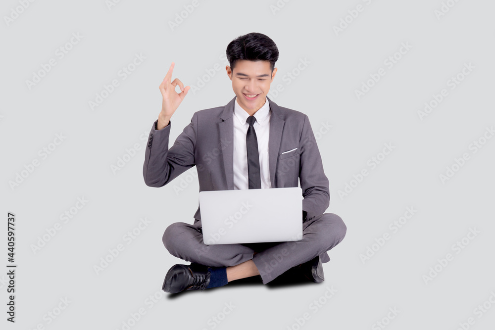 Young asian business man sitting work on laptop computer to internet online isolated on white background, businessman confident and notebook, freelance with success, marketing and communication. Young asian business man sitting work on laptop computer to internet online isolated on white background, businessman confident and notebook, freelance with success, marketing and communication.