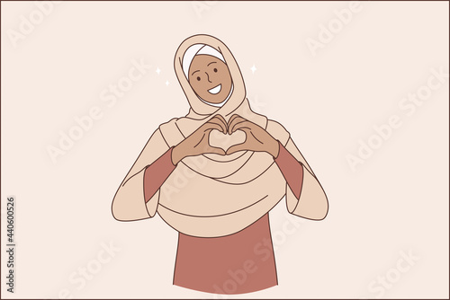 Islam women and love concept. Young smiling muslim woman in traditional clothing cartoon character standing and forming heart shape from fingers looking at camera 