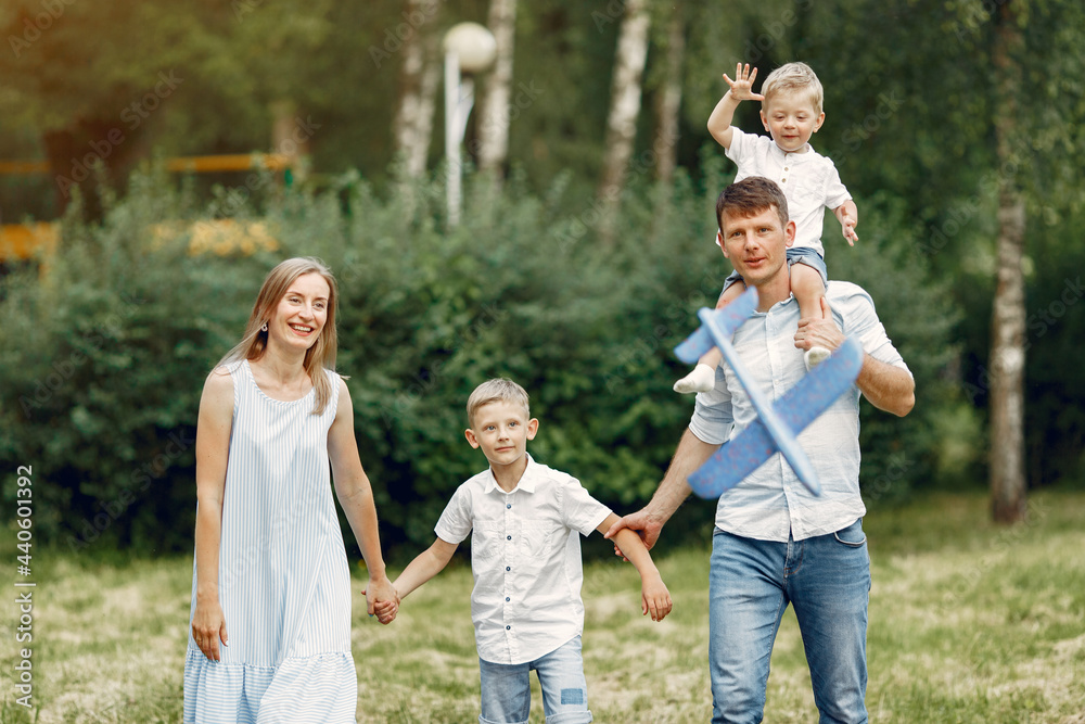 Family walks in a field and playing with toy plane Family walks in a field and playing with toy plane