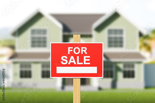 House for sale, red sign in front of blurred modern big building on grass