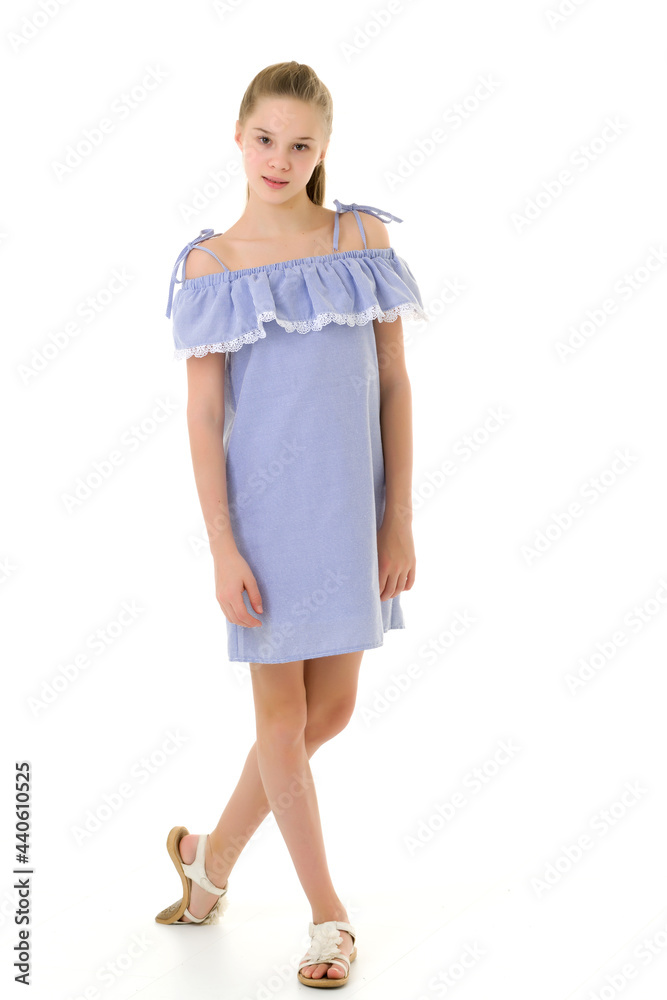 Pretty Girl in Fashionable Dress Standing and Smiling at Camera Pretty Girl in Fashionable Dress Standing and Smiling at Camera