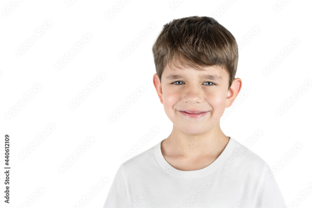Portrait of a young preschool boy in a light T-shirt on a white background, the boy has a happy face and beautiful blue eyes and he is sincerely smiling Portrait of a young preschool boy in a light T-shirt on a white background, the boy has a happy face and beautiful blue eyes and he is sincerely smiling