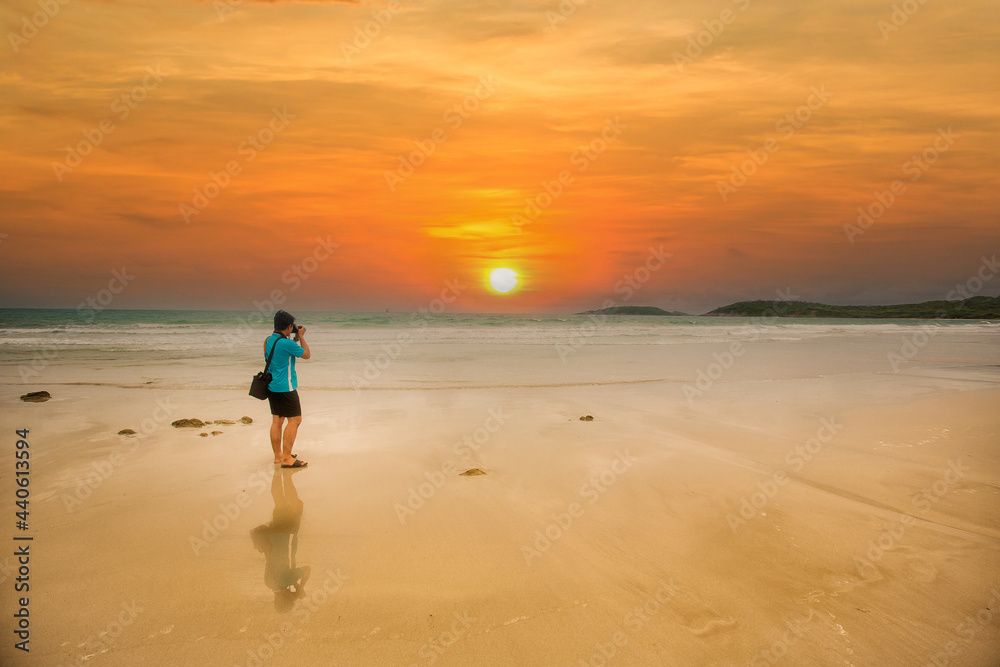 Photographer taking Thailand travel twilight sky photography. Man photographer shooting with tripod and DSLR camera at sunset with beautiful landscape twilight sky background. Photographer taking Thailand travel twilight sky photography. Man photographer shooting with tripod and DSLR camera at sunset with beautiful landscape twilight sky background.