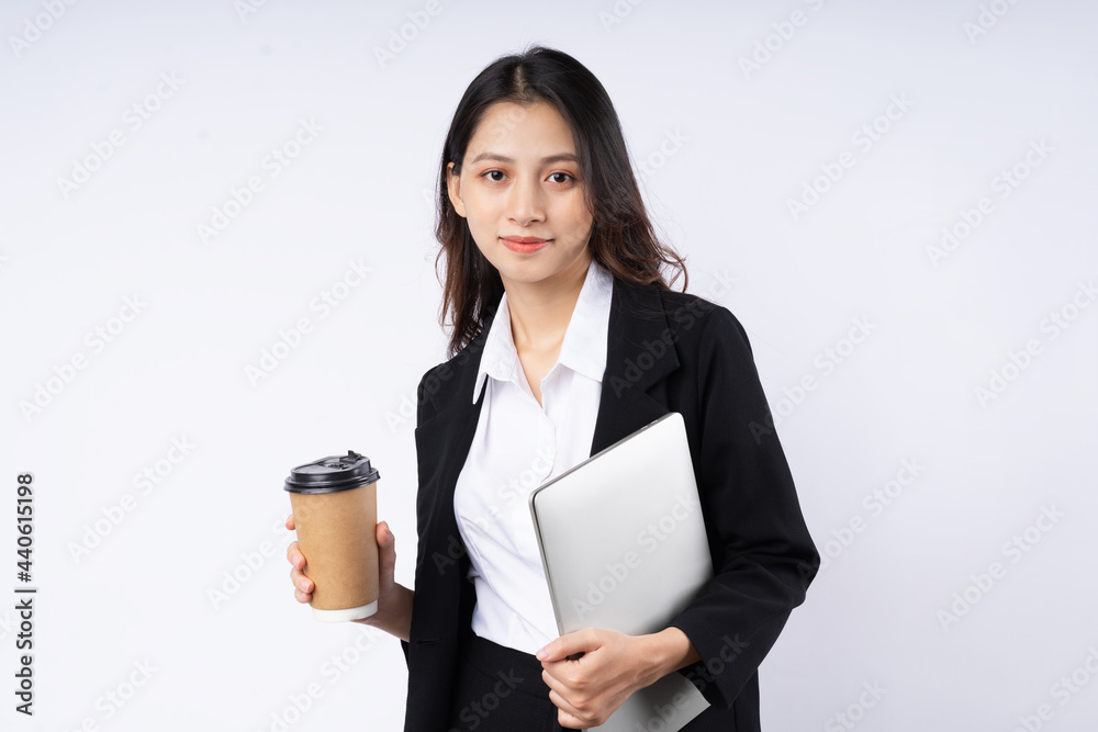 Portrait of young businesswoman wearing a suit, isolated on white background Portrait of young businesswoman wearing a suit, isolated on white background
