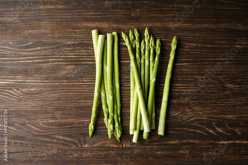 Fresh asparagus on wooden background. Flat lay.