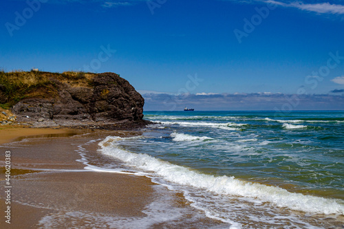 Fototapeta Naklejka Na Ścianę i Meble -  Beautiful sunny sand beach with waves