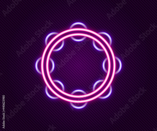 Glowing neon line Musical instrument percussion tambourine, with metal plates icon isolated on black background. Colorful outline concept. Vector