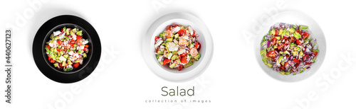 Salad with cucumber, sliced tomatoes and onion isolated on a white background.