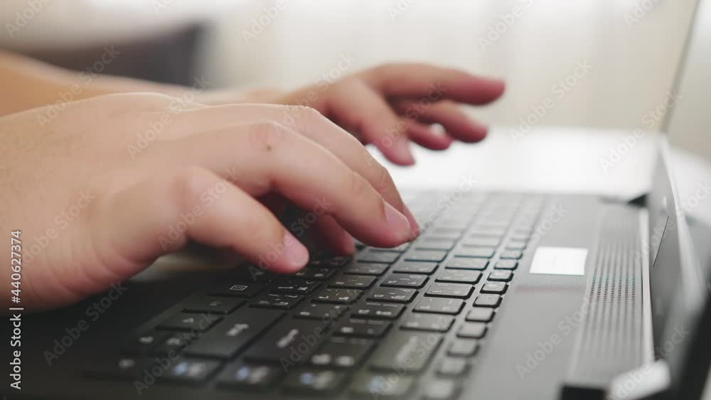 Detail of male hands working on laptop Detail of male hands working on laptop