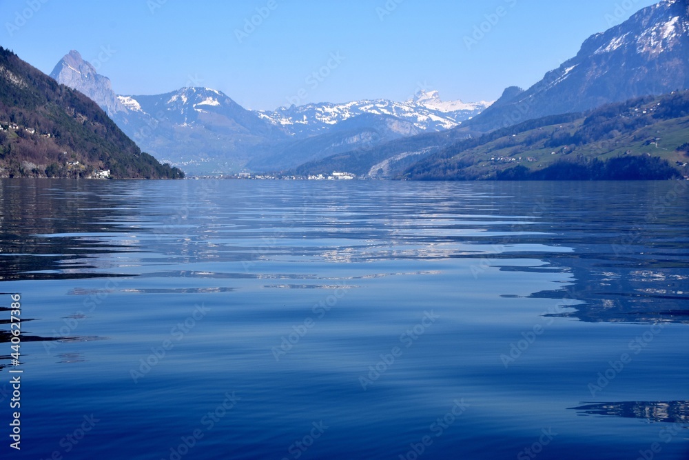 Lake Lucerne  with Alps mountains in on the horizon. Copy space in the foreground. Photo taken from a boat sailing across the lake.