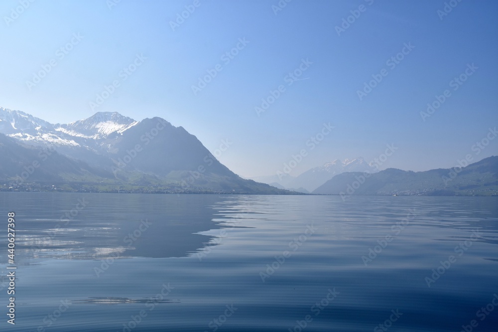 Lake Lucerne  with mountains in on the horizon. Copy space in the foreground. Photo taken from a boat sailing across the lake.