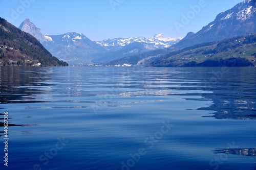 Lake Lucerne with Alps mountains in on the horizon. Copy space in the foreground. Photo taken from a boat sailing across the lake.