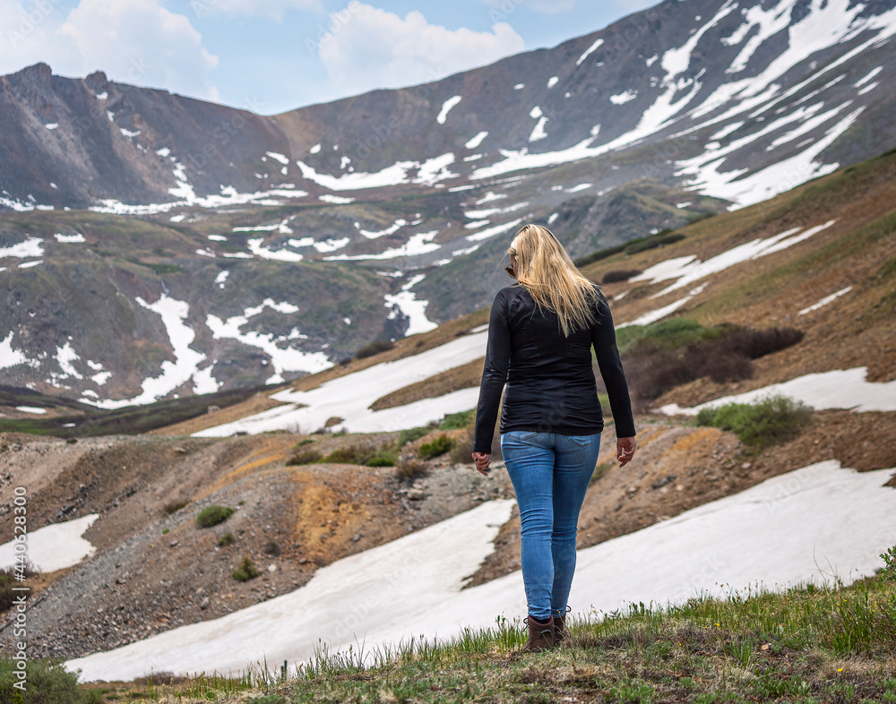 Portrait of a beautiful woman walking in the Rocky mountains 