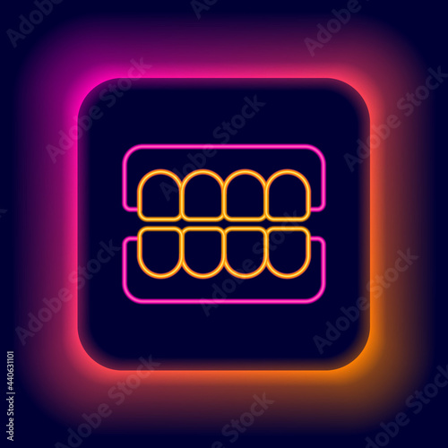 Glowing neon line False jaw icon isolated on black background. Dental jaw or dentures, false teeth with incisors. Colorful outline concept. Vector