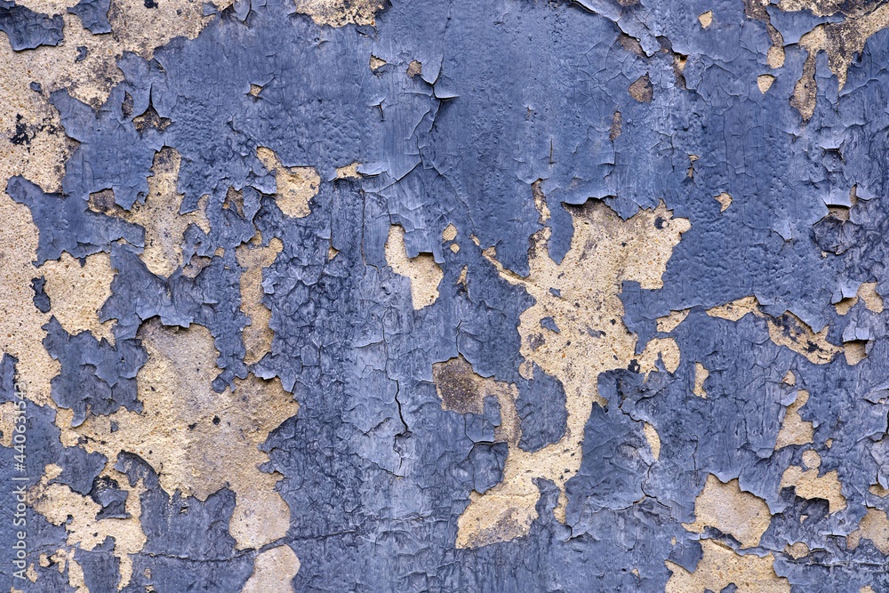 Old paint peeling from wall texture background
