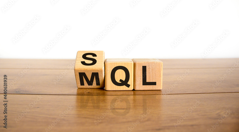 SQL or MQL symbol. Turned wooden cubes and changed words 'MQL marketing qualified lead' to 'SQL sales qualified lead'. Beautiful white background. Business and SQL or MQL concept. Copy space. SQL or MQL symbol. Turned wooden cubes and changed words 'MQL marketing qualified lead' to 'SQL sales qualified lead'. Beautiful white background. Business and SQL or MQL concept. Copy space.