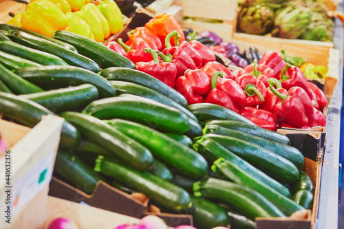Fresh organic bell peppers and zuccinis on market in Paris, France