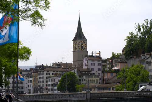 Church St. Peter at the old town of Zurich on a beautiful sunny summer day. Photo taken June 20th, 2021, Zurich, Switzerland.