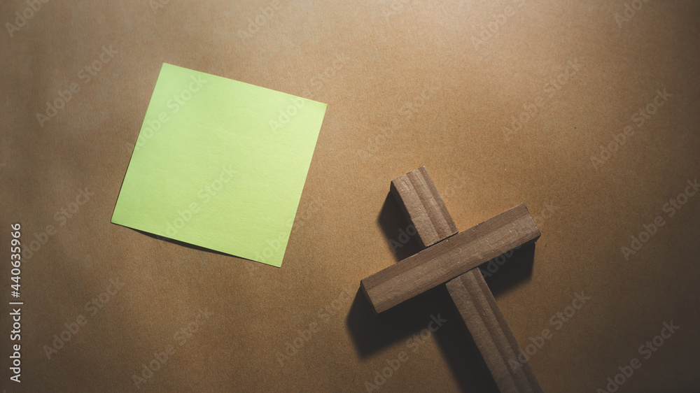 Christian cross on paper background, Christian symbol concept.