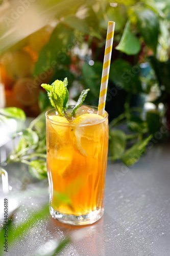 Vodka with orange dock and ice. Refreshing drink, culinary photography.