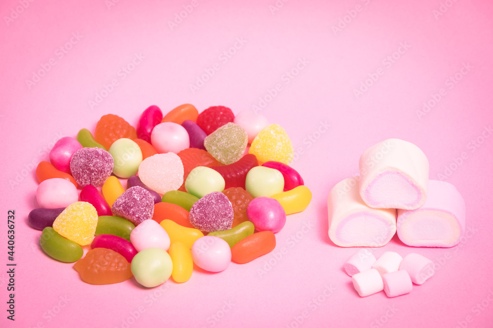 Sweet candies on a pink background. Sweets. Candy. Confectionery.