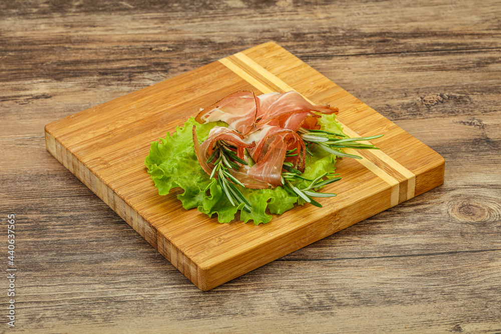 Sliced pork Jamon with rosemary