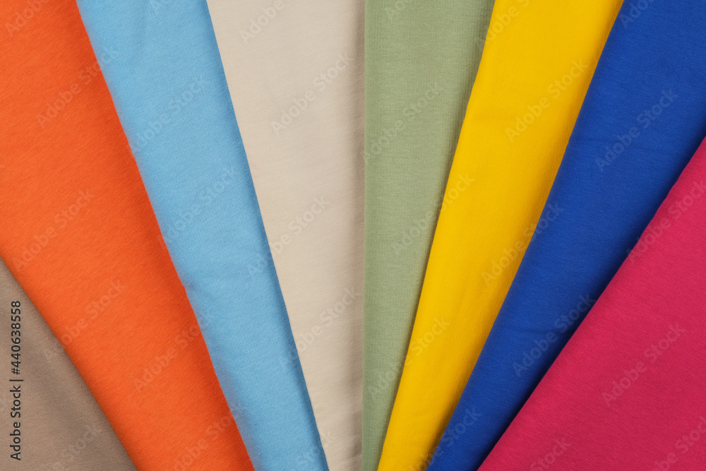 Background of different colors of fabric. Material for sewing. Macro photography.