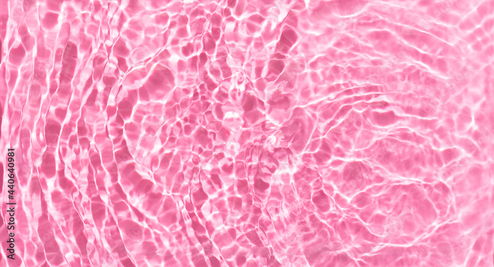 Fototapeta premium Pink Water transparent surface. Water waves,splashes, drops and ripples. Summer beauty concept.Top view. Copy space