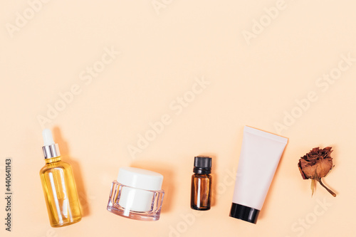 Flat lay beauty cosmetic products on beige background