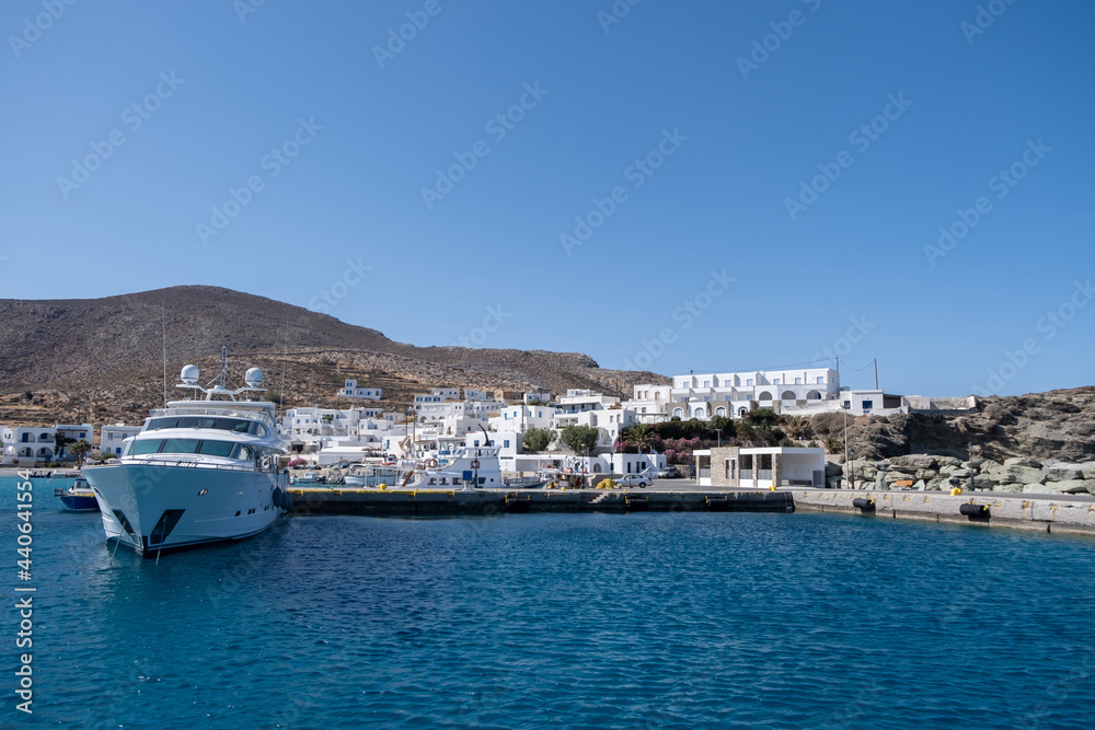 Yacht moored at Karavostasi Folegandros island port. Cyclades, Greece.
