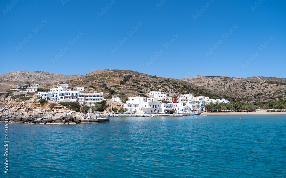 Sikinos greek island port, white buildings and blue sky background. Summer holidays at Cyclades, Greece.