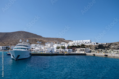 Yacht moored at Karavostasi Folegandros island port. Cyclades, Greece.