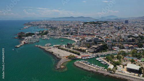 Aerial drone photo of famous and busy port of Piraeus where passenger ferries travel to Aegean destination islands as seen from high altitude, Attica, Greece