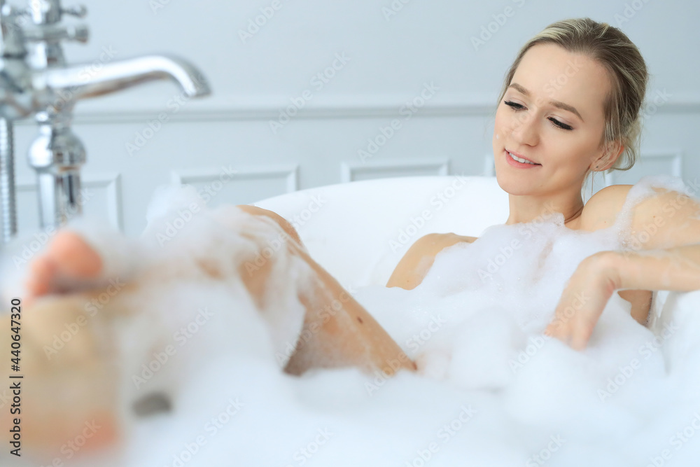 Naklejka premium Woman in a bathtub