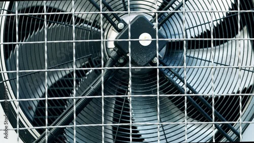 Wallpaper Mural Industrial refrigeration unit mounted on wall of warehouse building. Unit with external cooling fans. Rotating blades. Metal turbine. Air conditioning equipment. Protective steel grill. Freezer unit Torontodigital.ca