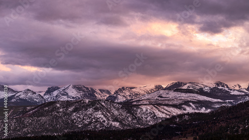Peaceful Winter Sunset at Rocky Mountain National Park with snow-capped mountains