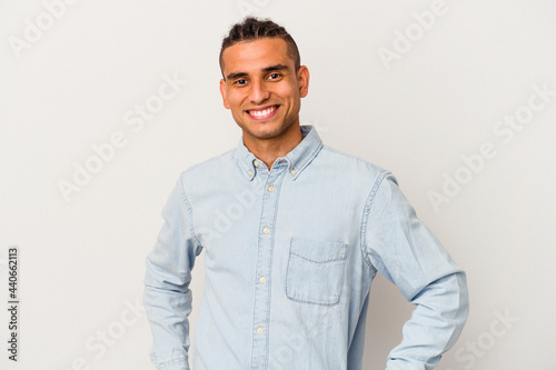 Young venezuelan man isolated on white background happy, smiling and cheerful.