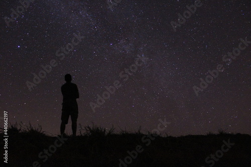 man watching the night sky