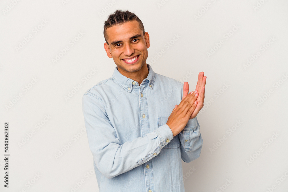 Young venezuelan man isolated on white background feeling energetic and comfortable, rubbing hands confident. Young venezuelan man isolated on white background feeling energetic and comfortable, rubbing hands confident.