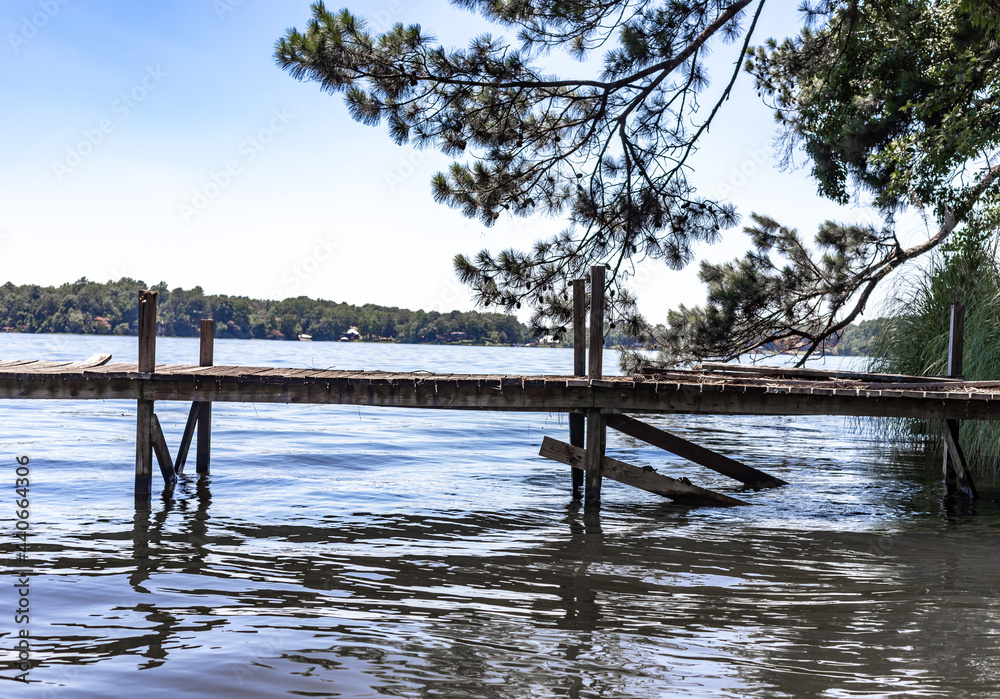 wooden pier on the river in Alabama during the summer wooden pier on the river in Alabama during the summer