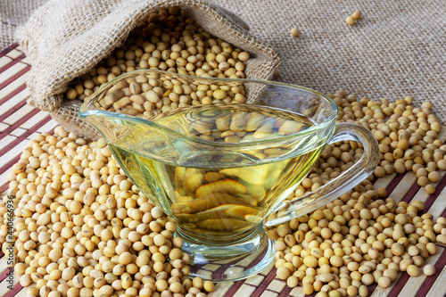 soy oil with soy beans on the table photo