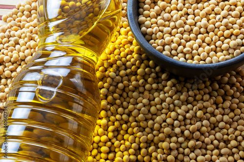 soy oil with soy beans on the table photo