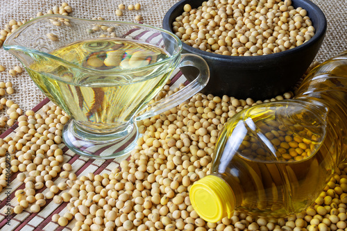 soy oil with soy beans on the table photo