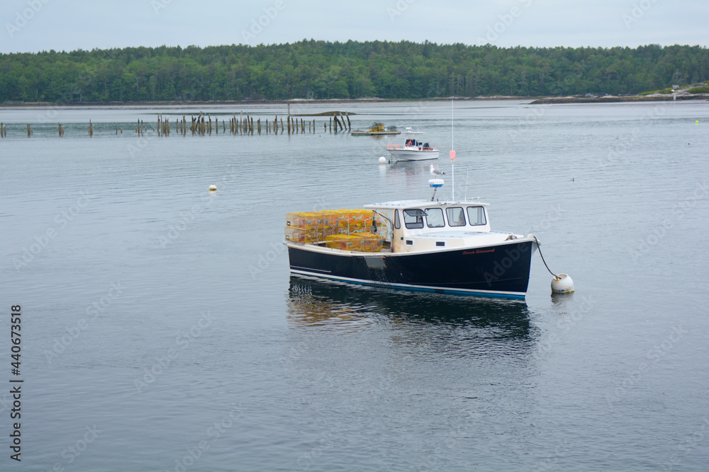 Lobster boat along the Maine coast in a bay of the Atlantic Ocean
