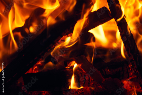 A fire burns in a fireplace, Fire to keep warm. Logs burning in a fireplace