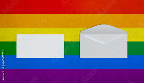 Colorful rainbow gay pride background with paper letter, bag, business card,stationery  and phone mail premium mockup simulation with a flag symbol of Lgbtq social movement behind stationary