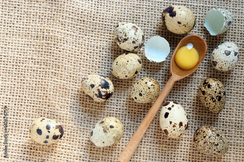 Quail eggs and wooden spoon