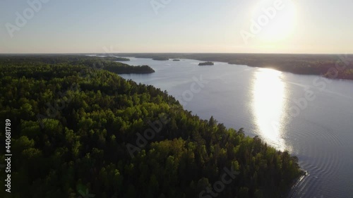 Aerial view over spring color forest, in the archipelago of Sweden - tilt, drone shot photo