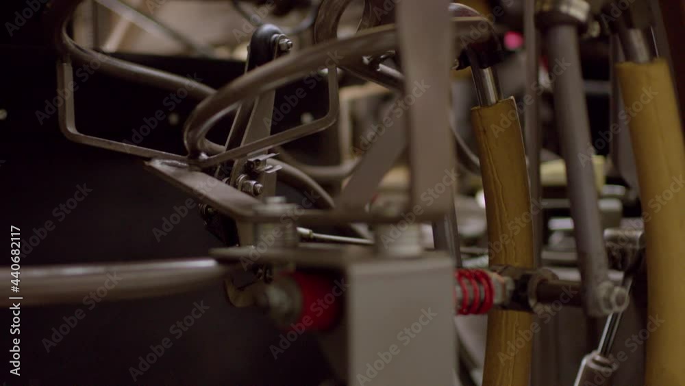A bowling ball passes through the pinsetter machine at a bowling alley.