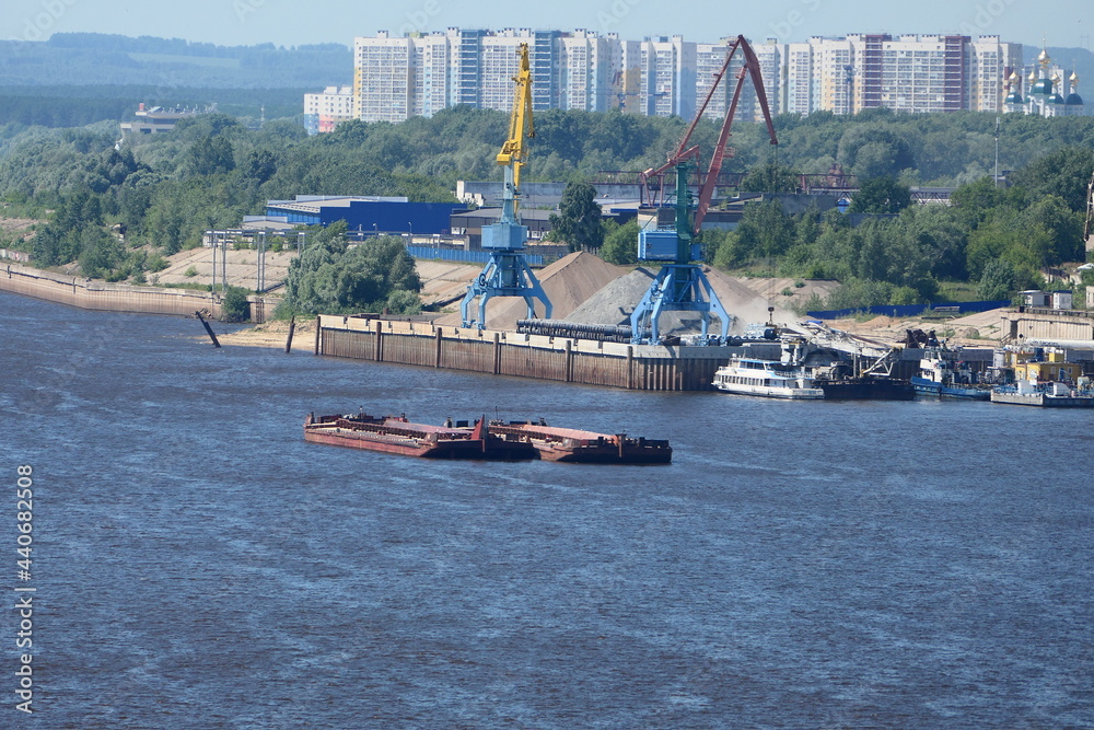 River port. Extraction and transportation of river sand on barges in the summer. High quality photo